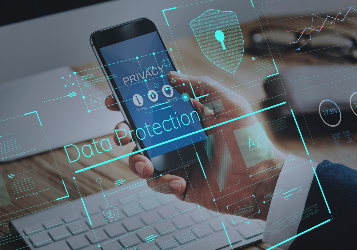 Man holding mobil phone with data protection digital icons floating around