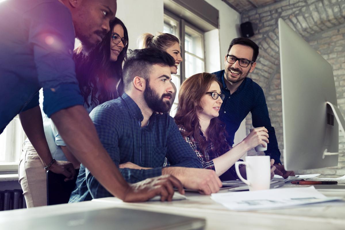 Young business people looking at someting on computer