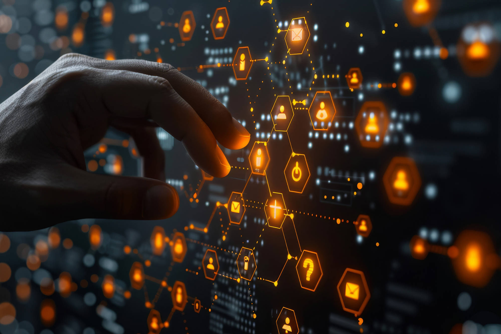 Hand reaching towards futuristic display of icons in orange hexagons
