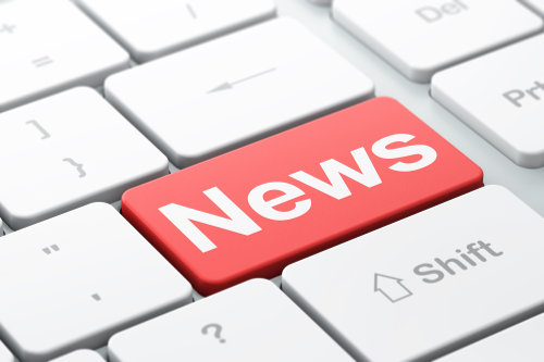Close up of keyboard with the return key replaced with 'News' in white on red