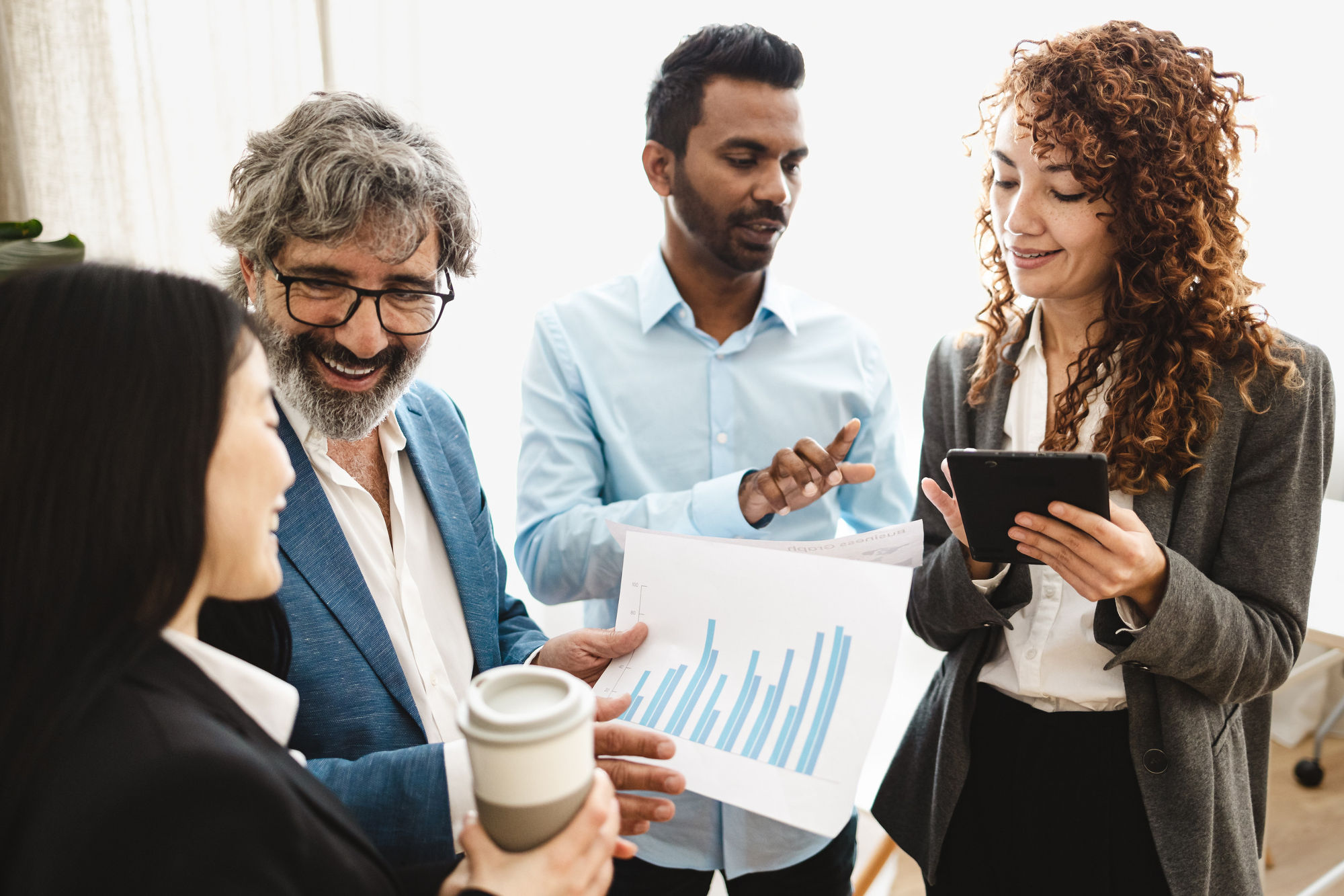 Smiling employees standing in a group