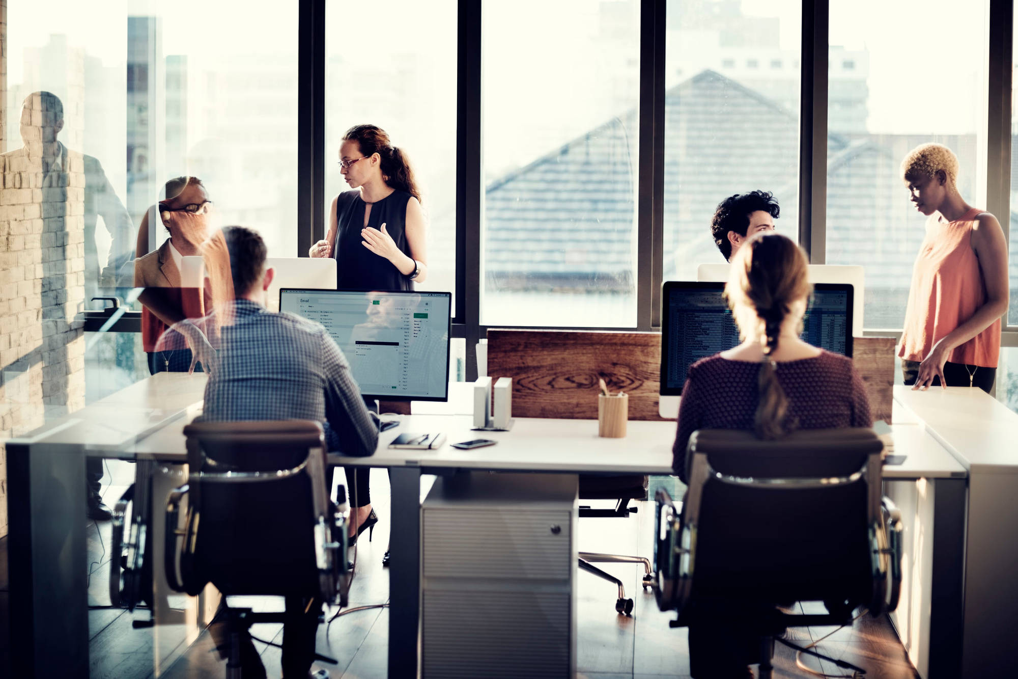 People working in a conference room talking