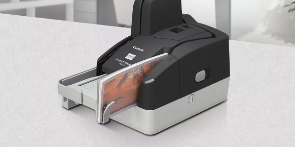 Check scanner with a stack of checks in the input