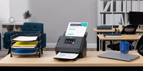 Office scanner sitting on a desk in an office